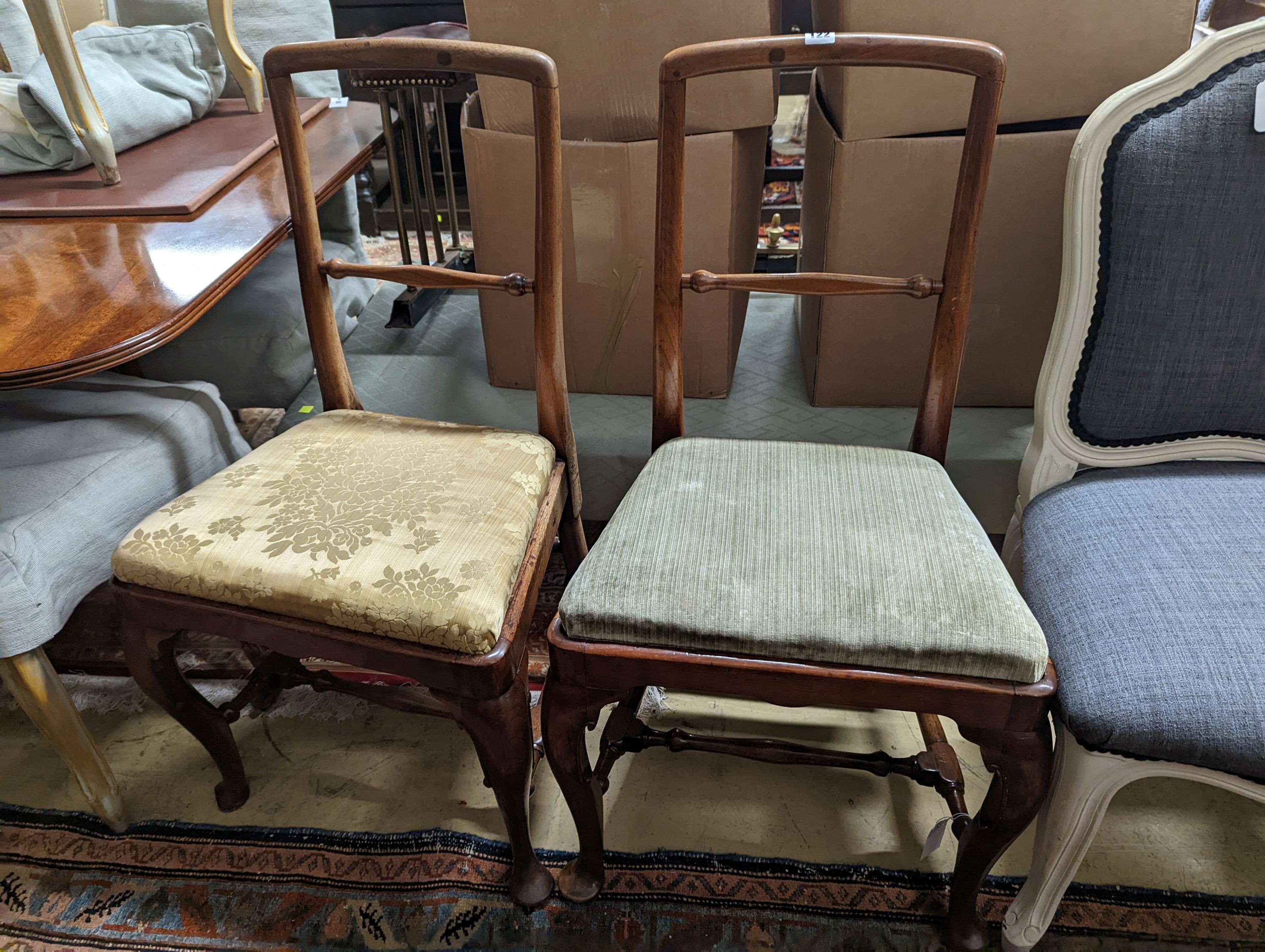 A pair of George II walnut dining chairs